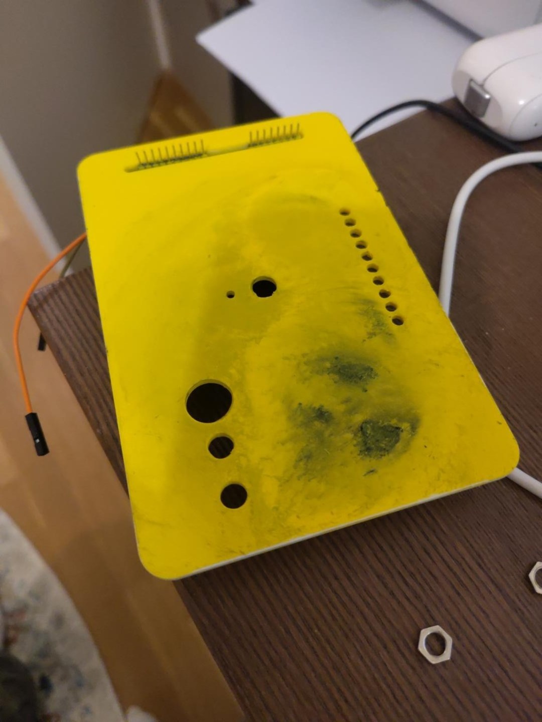 Black smears on the yellow reactor panel, retained as industrial weathering